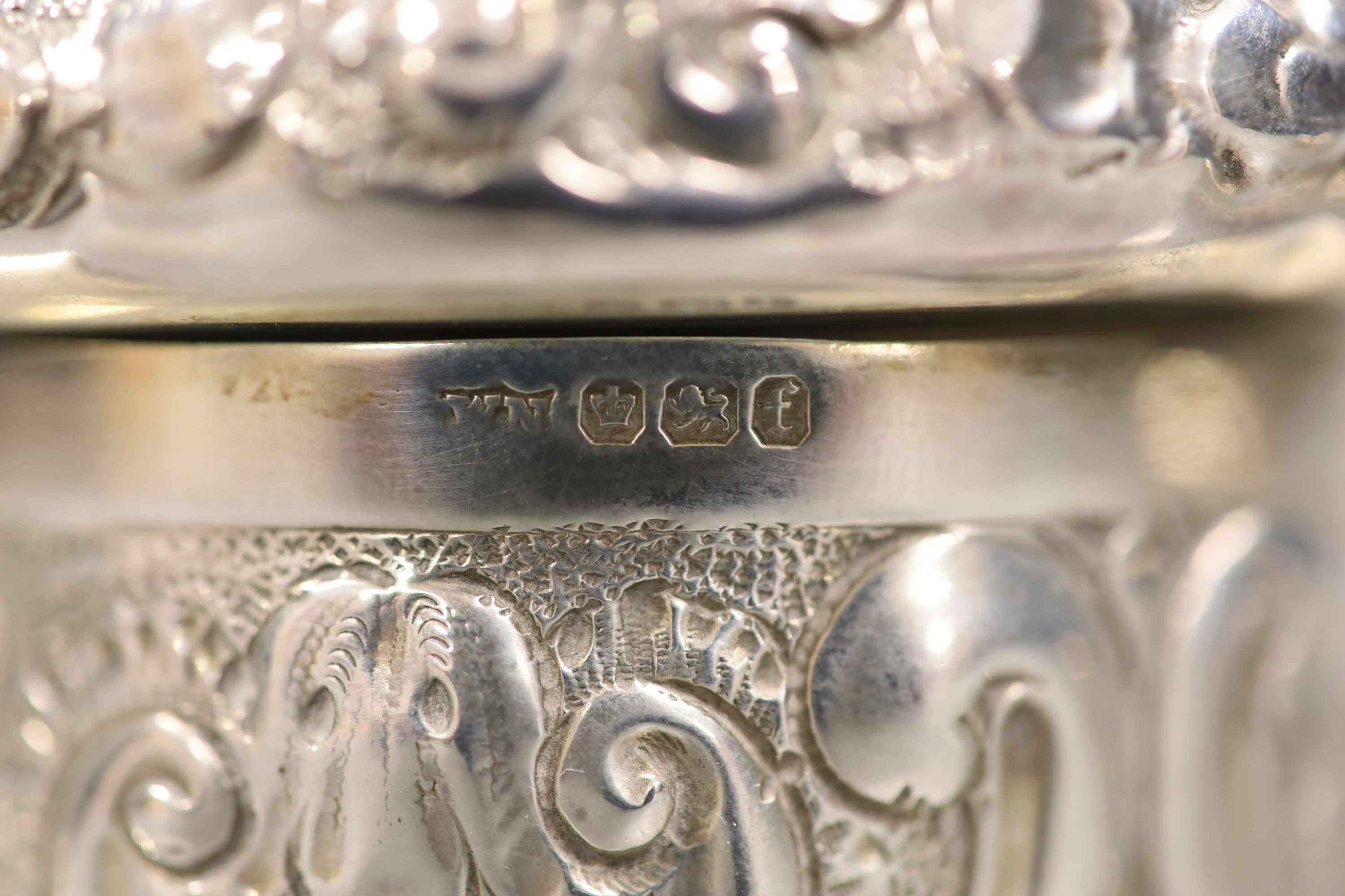 A Georgian silver snuff box of oval form, together with a small tea strainer and three other silver boxes, 10.5oz.